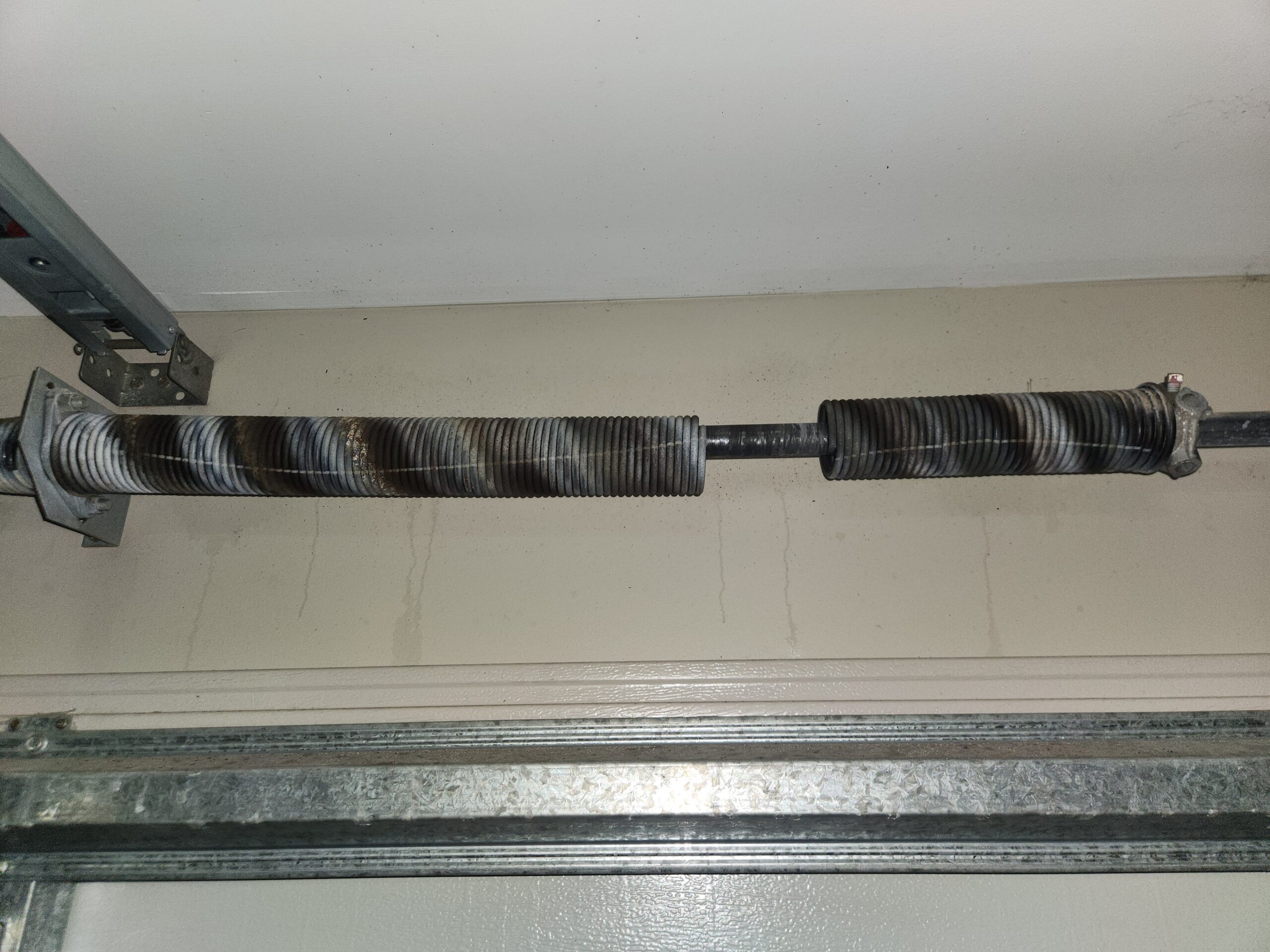 garage-door-springs Garage door technician performing repair work across Brisbane, Logan, Ipswich, Redlands, Moreton Bay and the Gold Coast