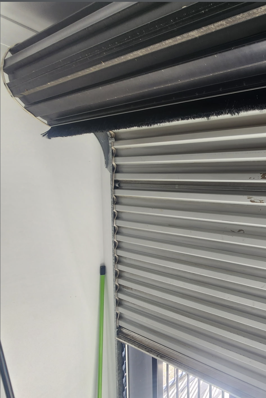 Roller Door Weather Seal Garage door technician carrying out routine maintenance for homes in Brisbane, Logan, Ipswich, Redlands, Moreton Bay and the Gold Coast